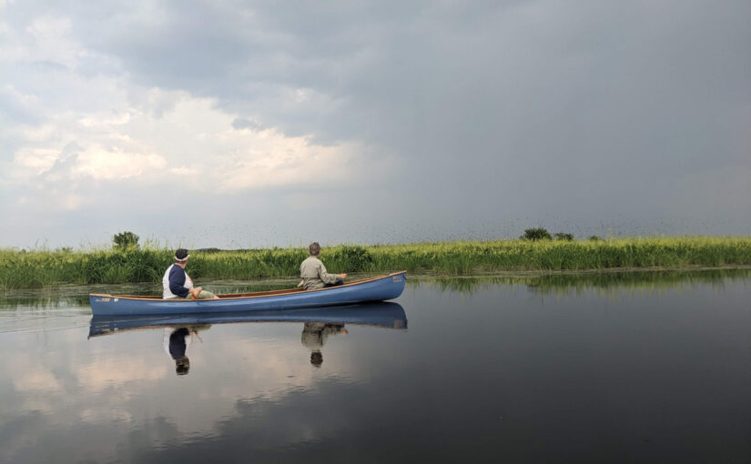 Changing weather, redwing black birds (hard to see) - canoe on Fox River